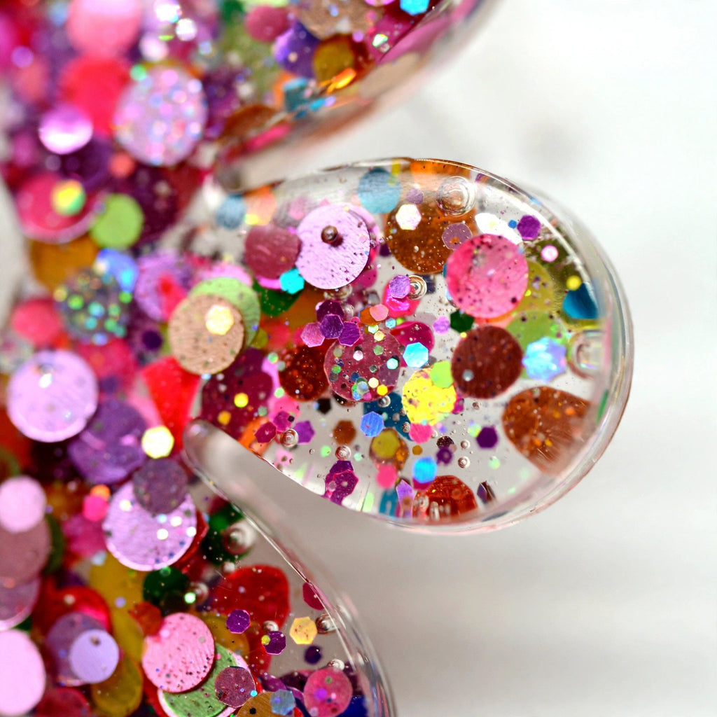 Boucles d'oreilles marguerite pailletée rose