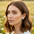 Puces d'oreilles marguerite blanche