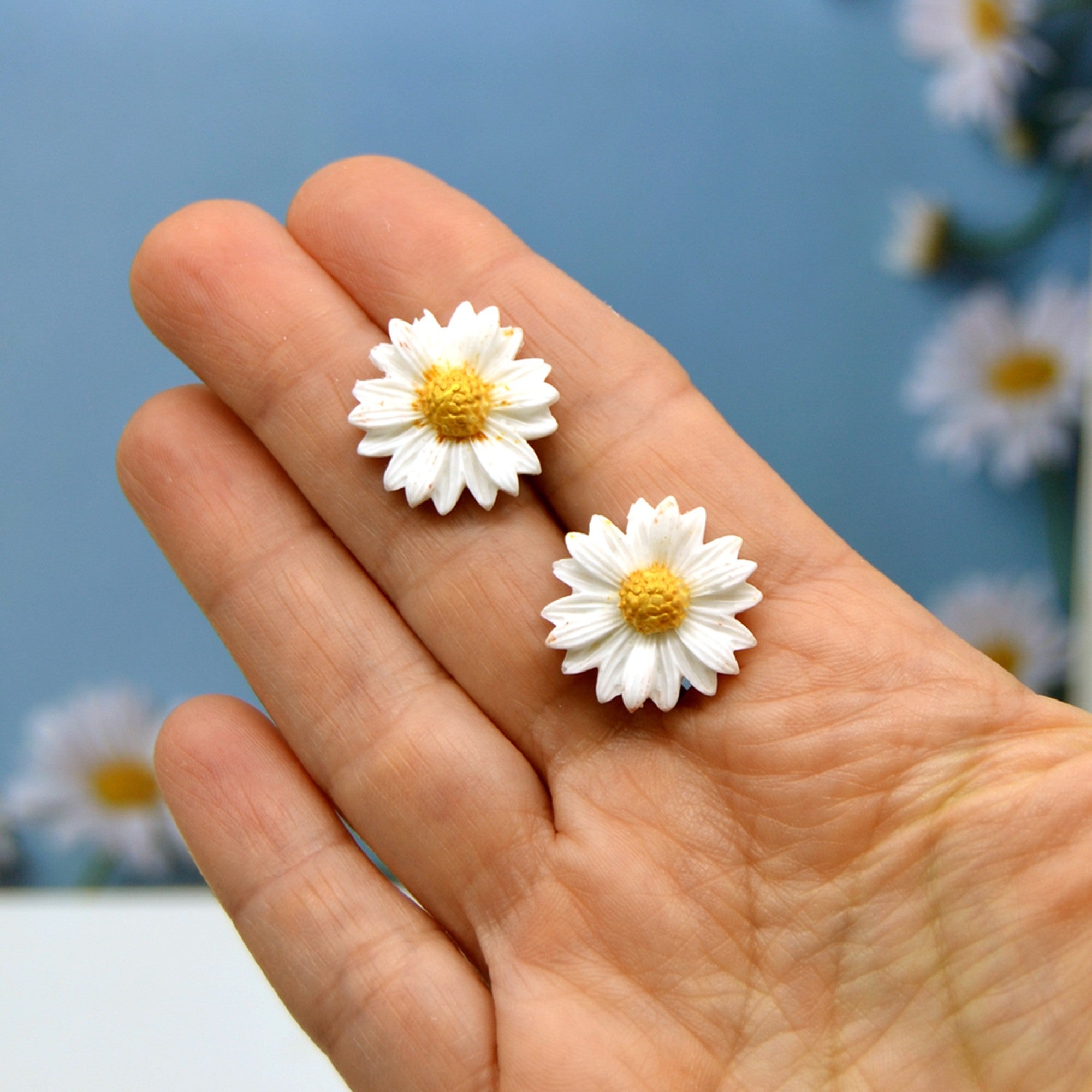 Puces d'oreilles marguerite blanche